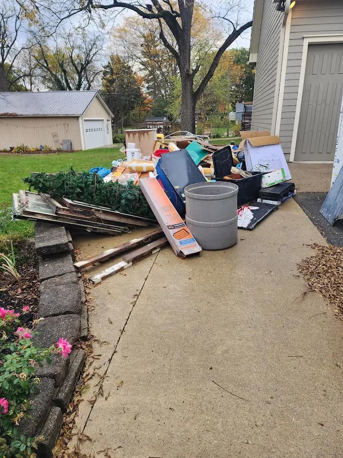 Dumpster being loaded with debris for Estate Cleanout Dumpster Rental in Kutztown